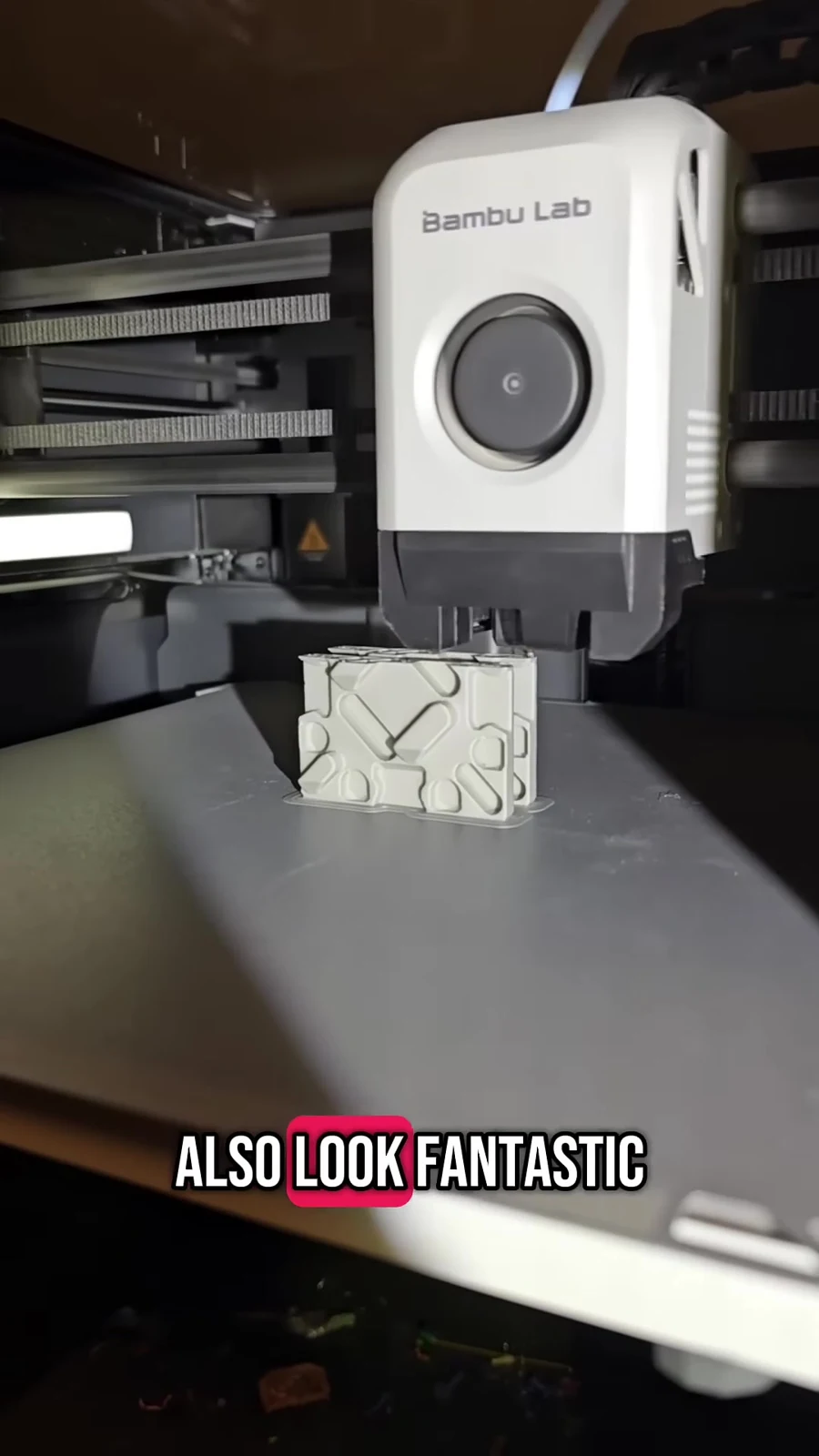 A floor tile printing upright beneath a printer head