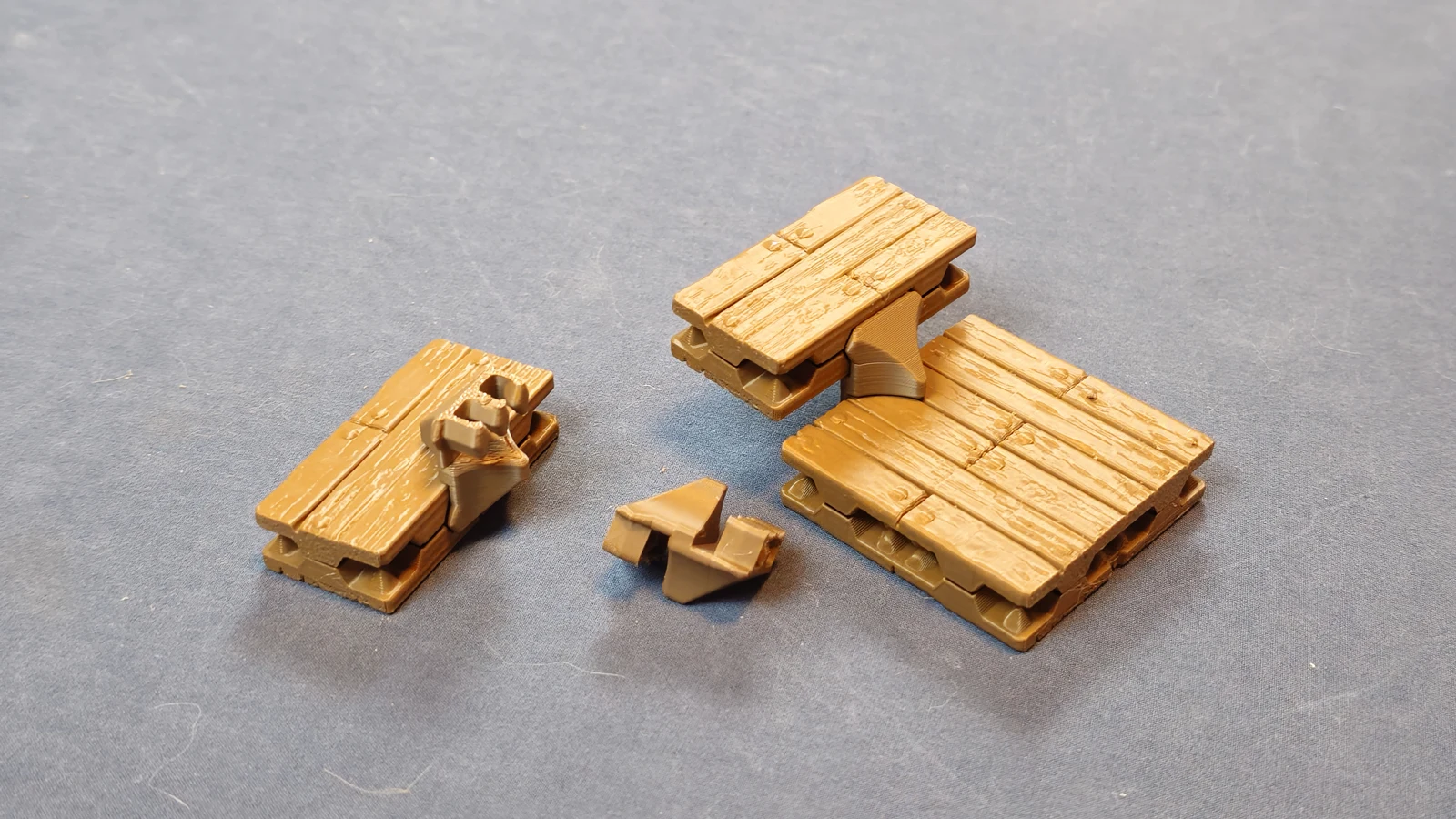 Loose stair clip beside an assembled step and a tile showing the underside attachment